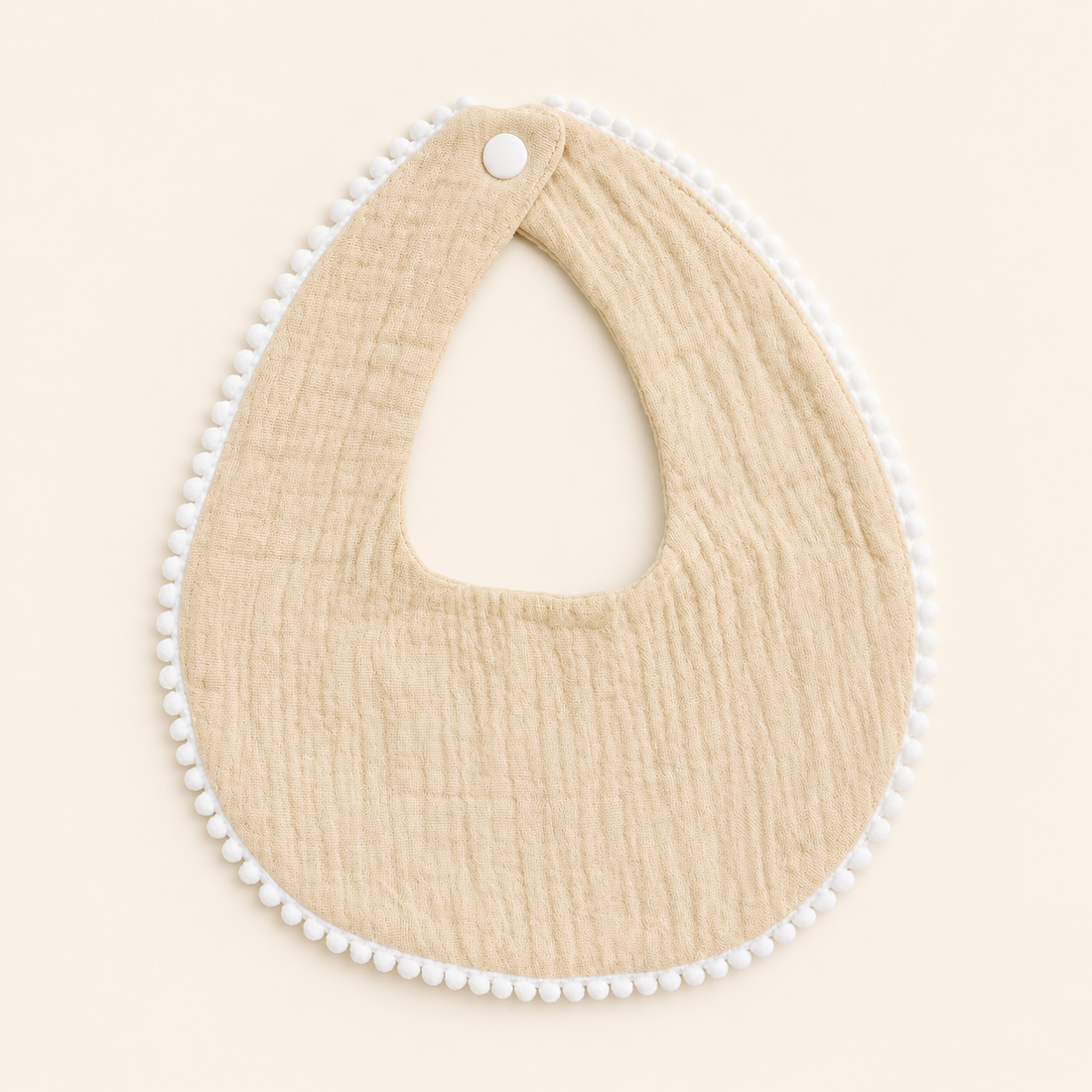 Bavoir avec bordure perlé