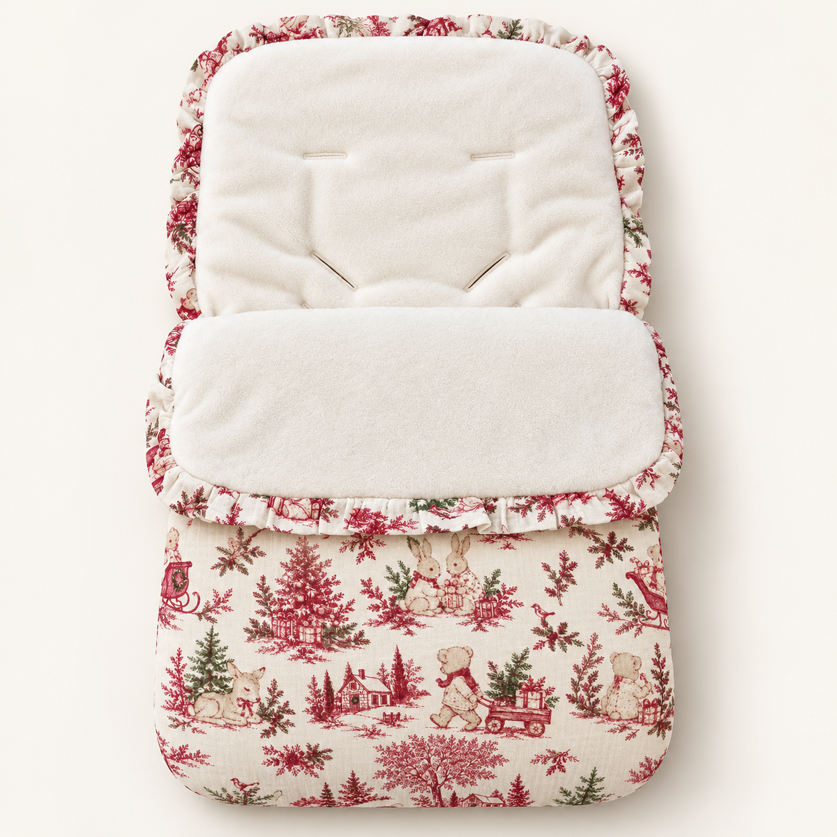 Nid d’ange bébé motif Noël, intérieur ivoire et finition volantée
