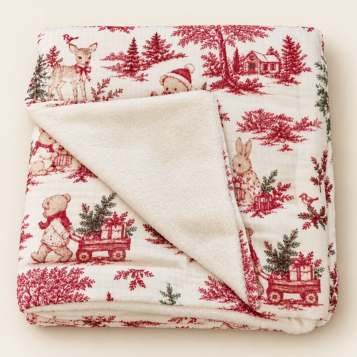 Plaid bébé motif Noël rouge et vert sur fond écru, avec revers doux ivoire